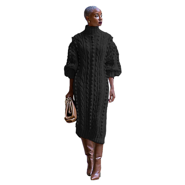 Woman wearing a black cable knit dress with brown boots on a white background