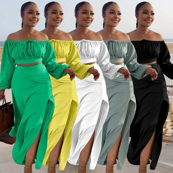 Five women in off-shoulder top and skirt sets in green, yellow, white, light blue, and black standing together.