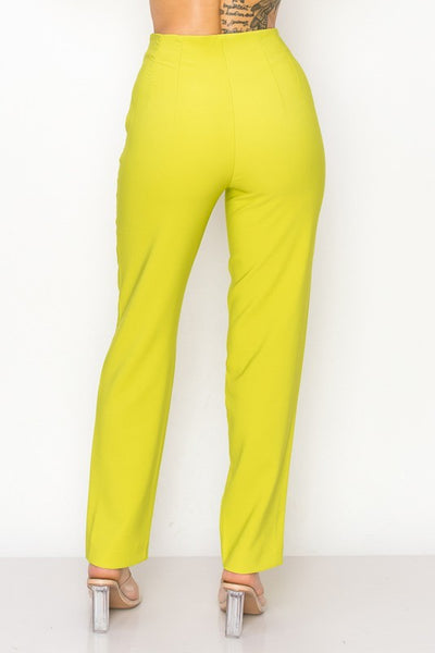 Lemon pants worn by a person on a white background