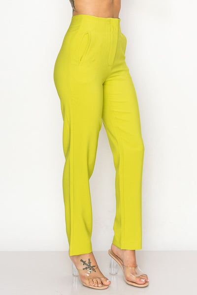 Lemon pants worn by a person on a white background