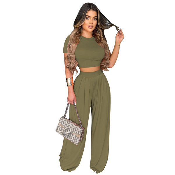 Woman wearing green outfit with a white background