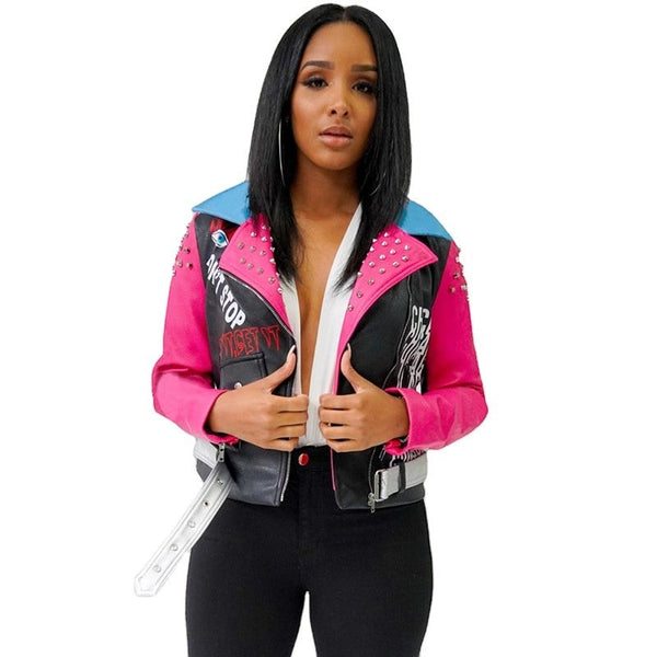 SlayEdgeBoutique faux leather moto jacket with hot pink, black, and blue graphic print and metallic stud detailing.