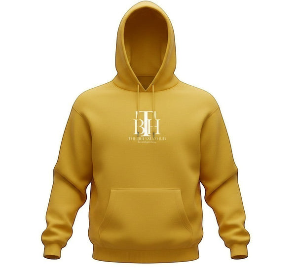 SlayEdgeBoutique mustard yellow pullover hoodie with The Blessed Hub International logo and kangaroo pocket