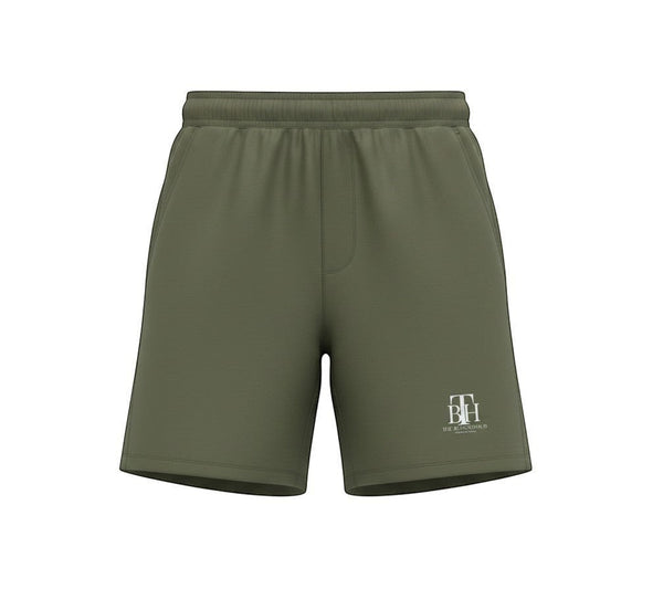 SlayEdgeBoutique olive green athletic performance shorts with THE BLESSED HUB INTERNATIONAL logo and side pockets.