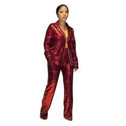 SlayEdgeBoutique red sequin blazer and matching trouser set worn by a model for a glamorous evening look.