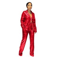SlayEdgeBoutique red sequin blazer and trouser matching set worn by a model for a glamorous evening look.