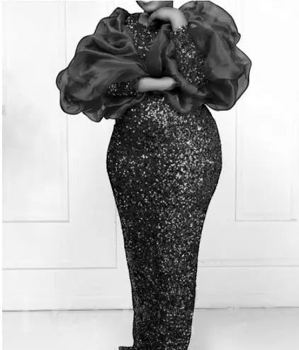 SlayEdgeBoutique floor-length formal evening gown with a sequined bodice and dramatic organza puff sleeves.