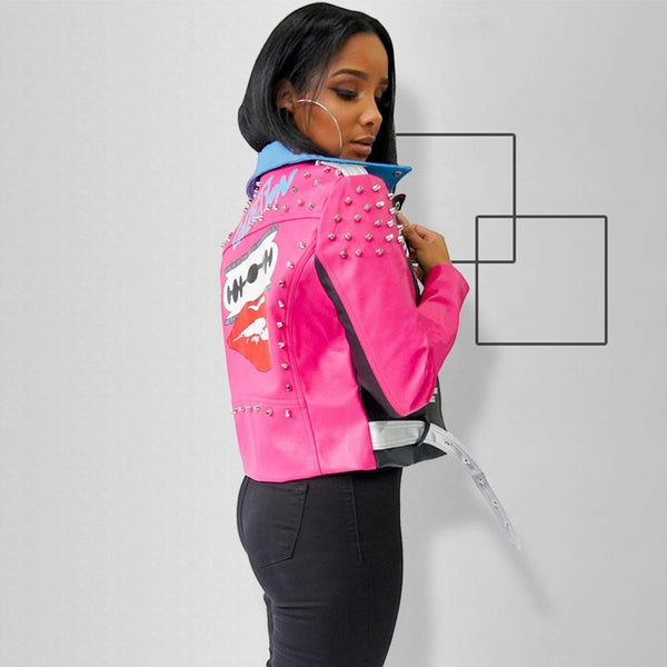 SlayEdgeBoutique faux leather moto jacket in hot pink, black, and blue with metallic studs and back graphic print.